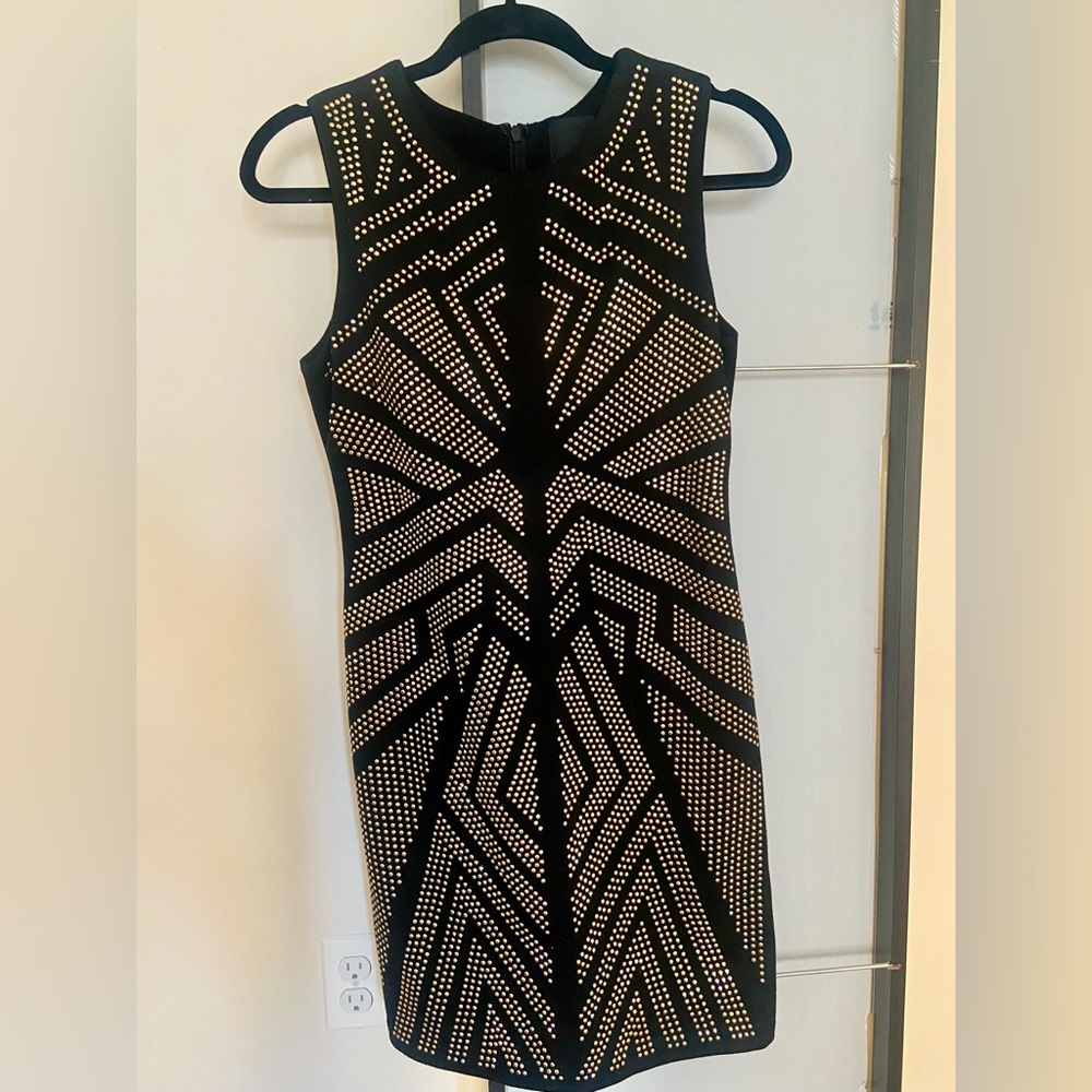 Black dress with gold embellishments.